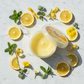Glamour Touch Lemon Wax flat lay with lemons and flowers